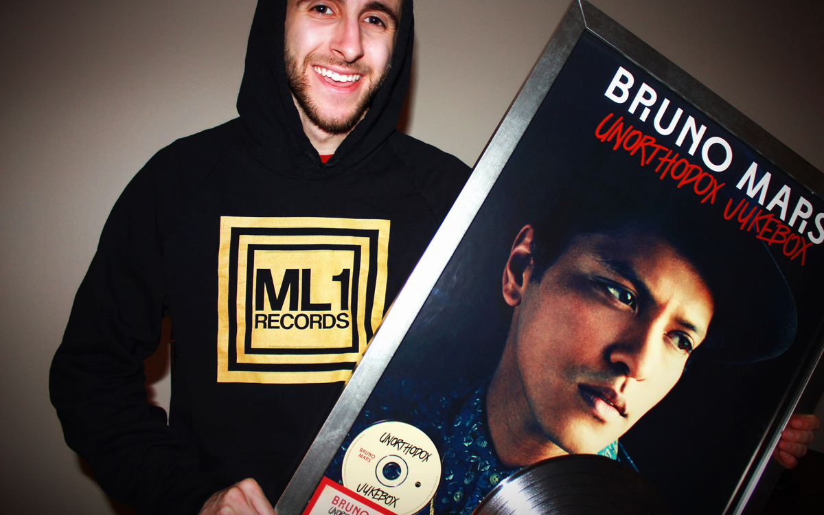 Joseph Karre with Bruno Mars RIAA Platinum Plaque for Unorthodox Jukebox